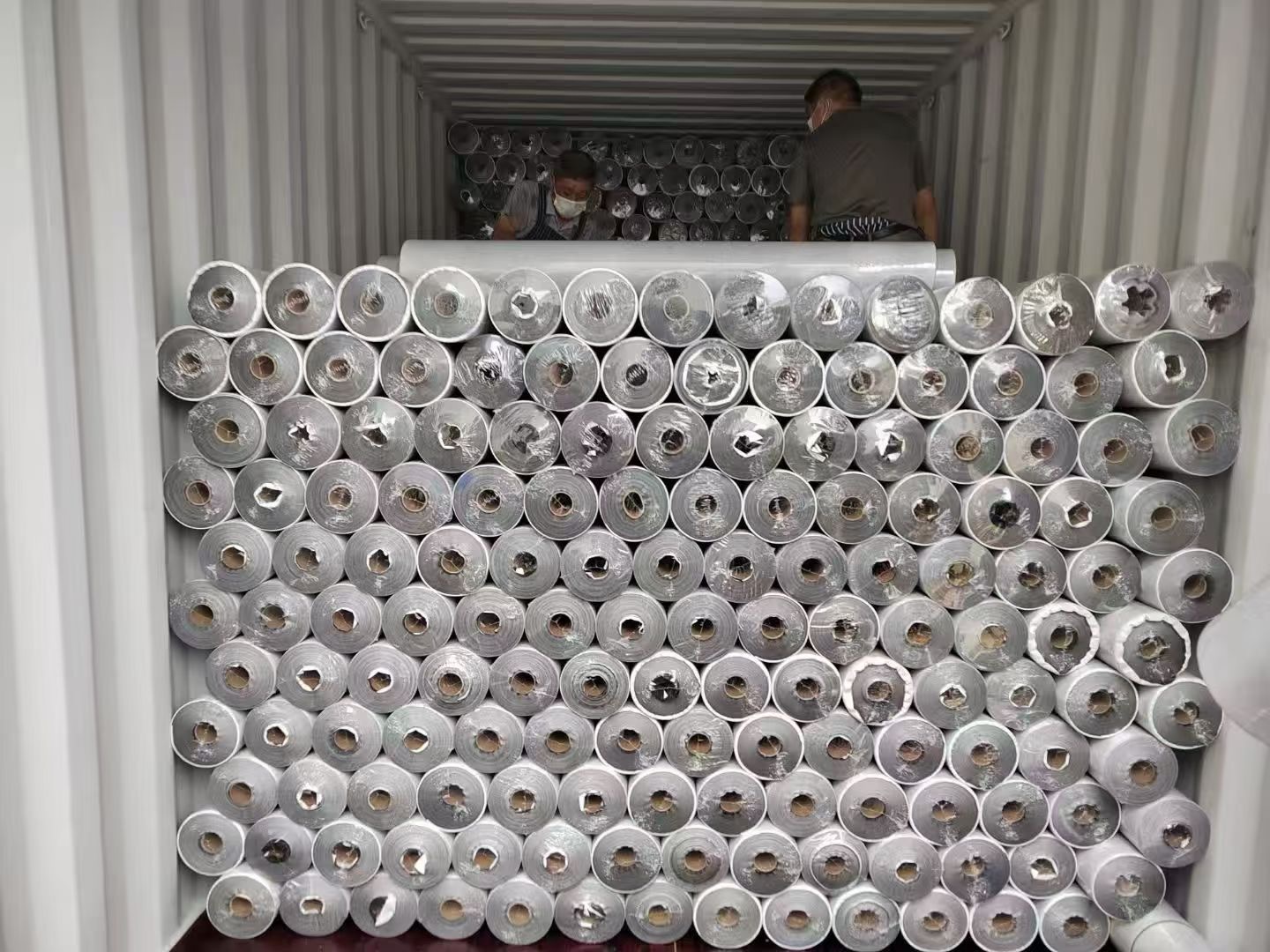 Breathable membrane roll goods stacked for storage