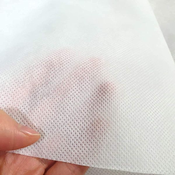 Close-up of white nonwoven material texture
