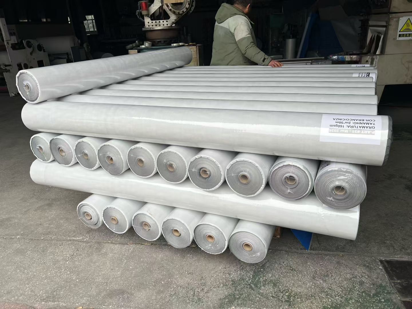Waterproof breathable membrane rolls in warehouse storage